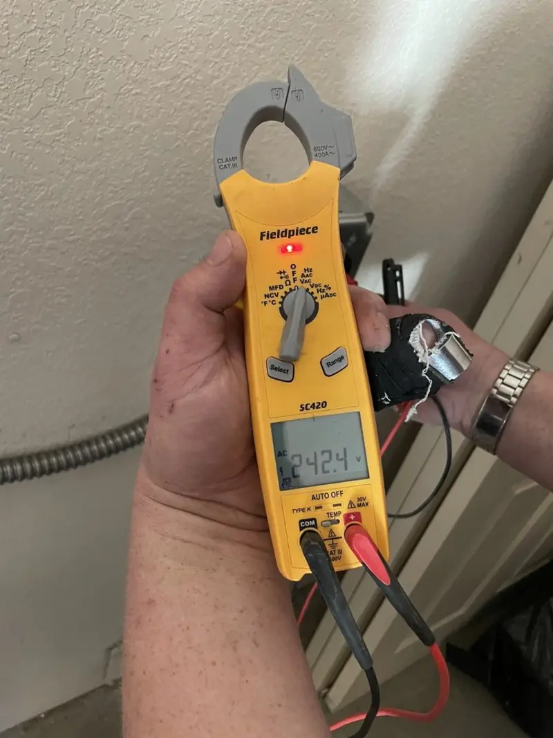 Voltage testing with clamp meter during Circuit Breaker Repair in Heber Springs